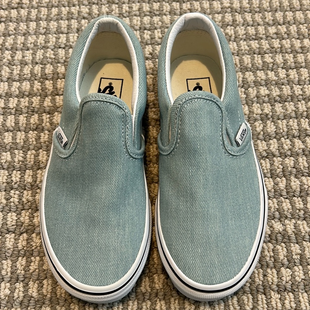 Brand new never worn Vans classic slip-ons denim blue with white trim. In box.